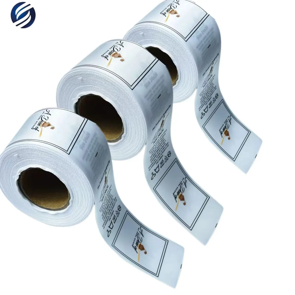 Three printed satin care label rolls with repeated custom brand layouts