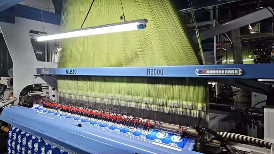 Computerized weaving machine producing garment trims