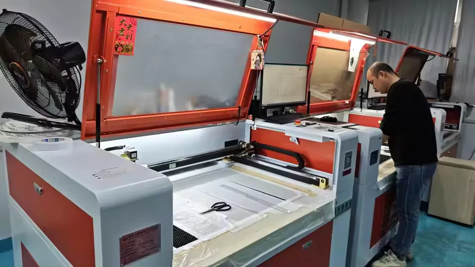 Operator using a laser cutting machine for custom trim shapes