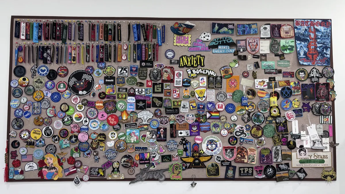 Sample wall with garment labels patches and fabric key tags