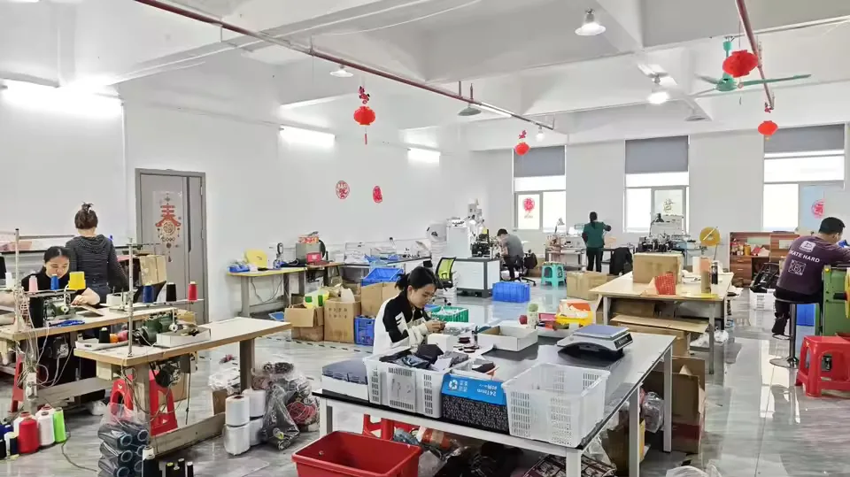 Wide view of SAIM Label production workshop with operators