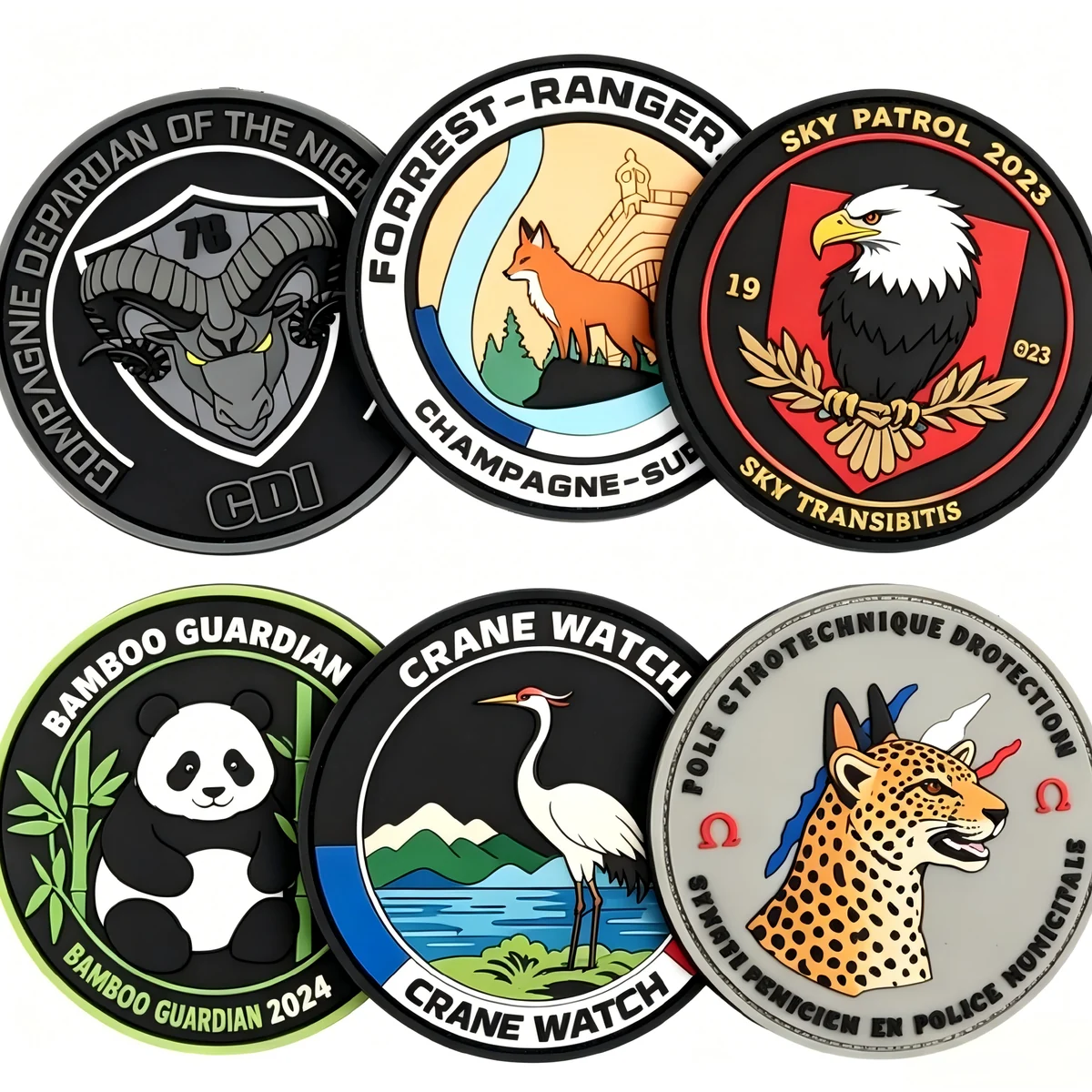 Collection of custom round PVC rubber patches with raised emblem designs