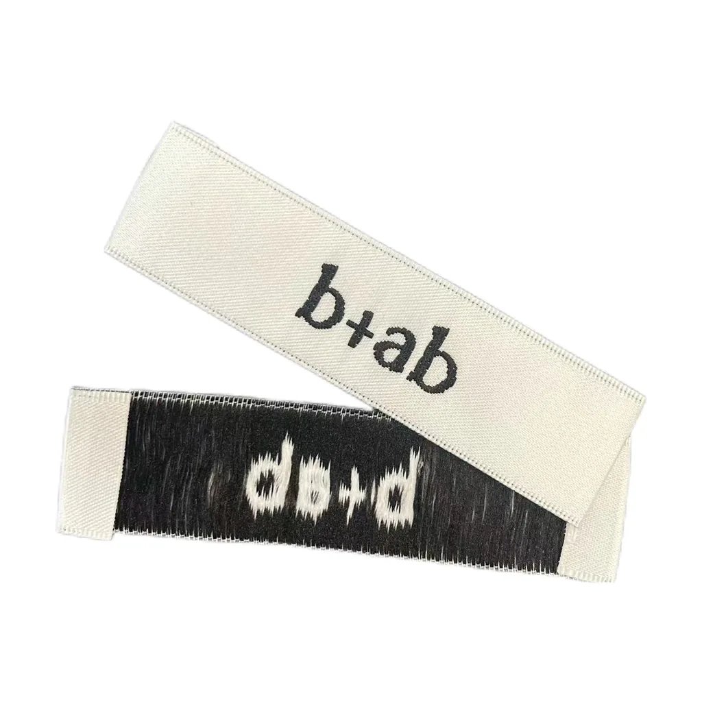 Custom woven b+ab and do+d brand labels in cream and black