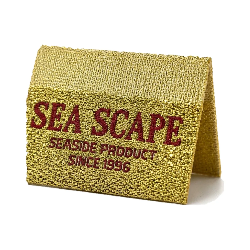 Gold metallic woven Sea Scape center-fold brand label