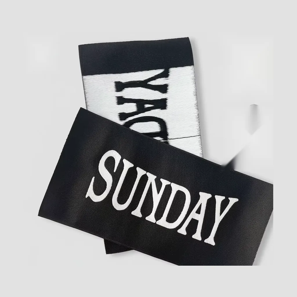 Woven Sunday brand labels in black and white damask