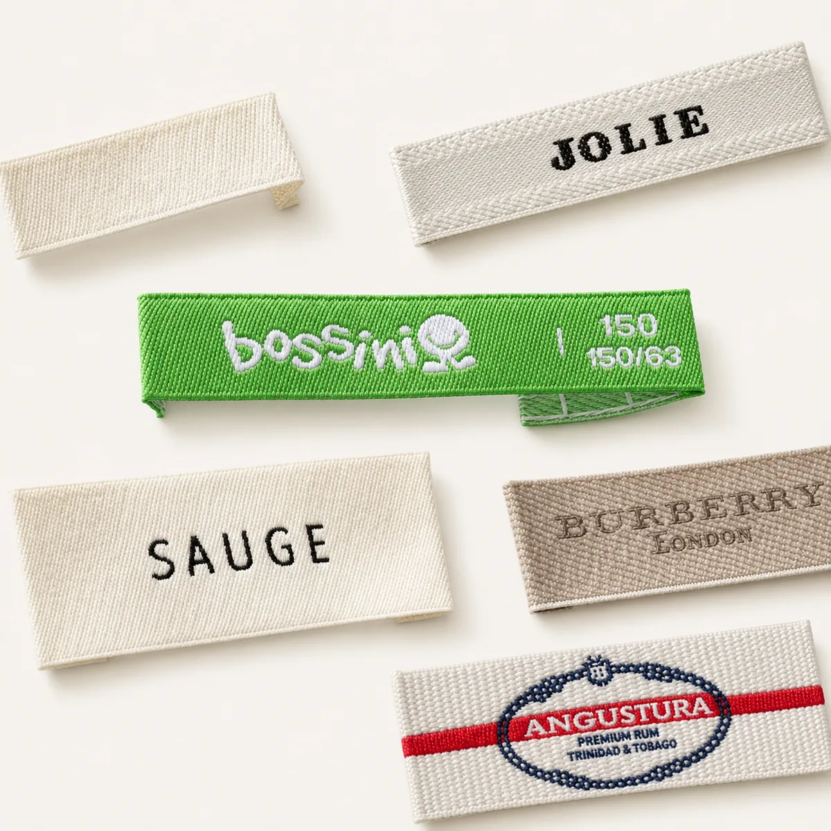 Assorted woven brand and size labels in multiple colorways and fonts