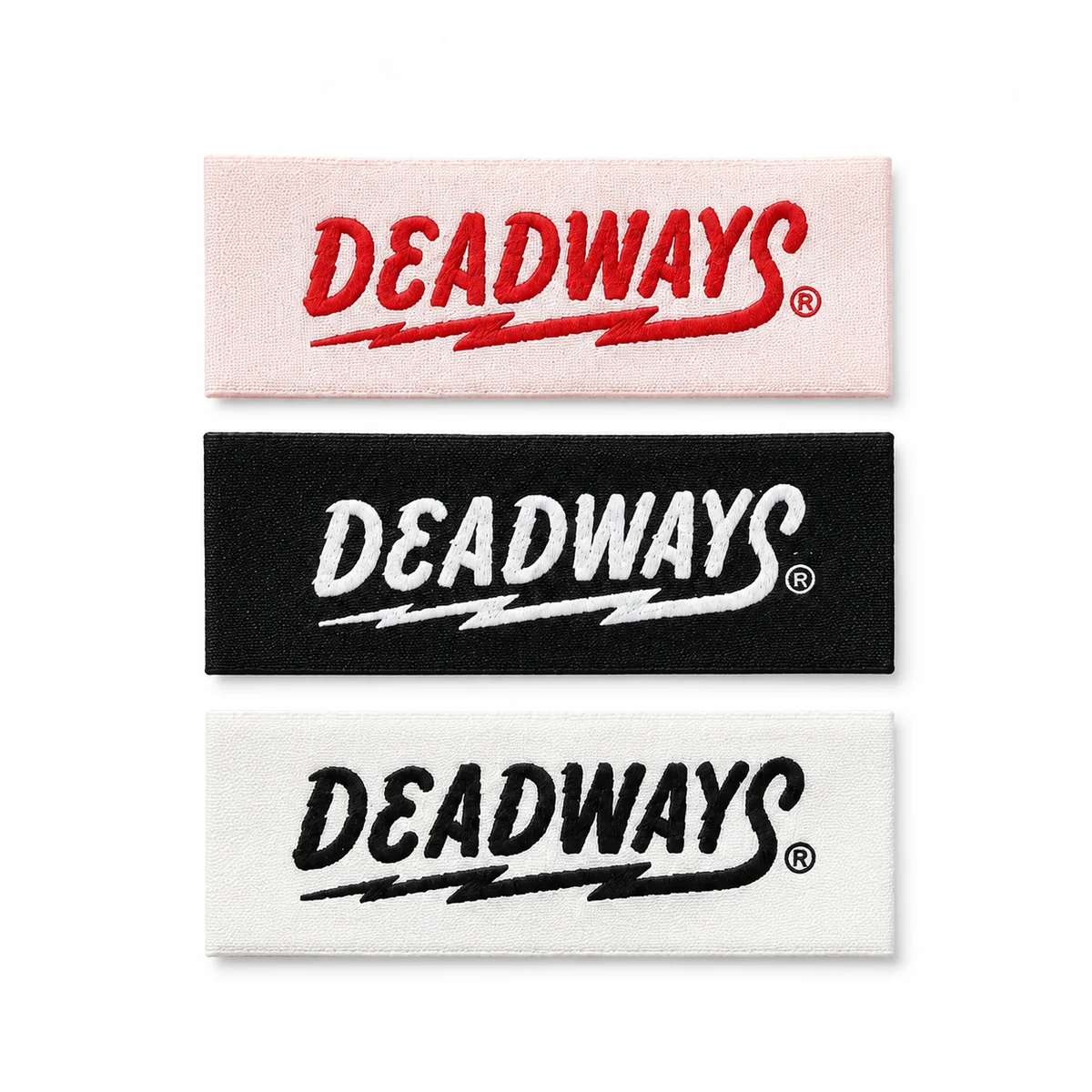 Custom woven DEADWAYS brand labels in pink, black and white colorways