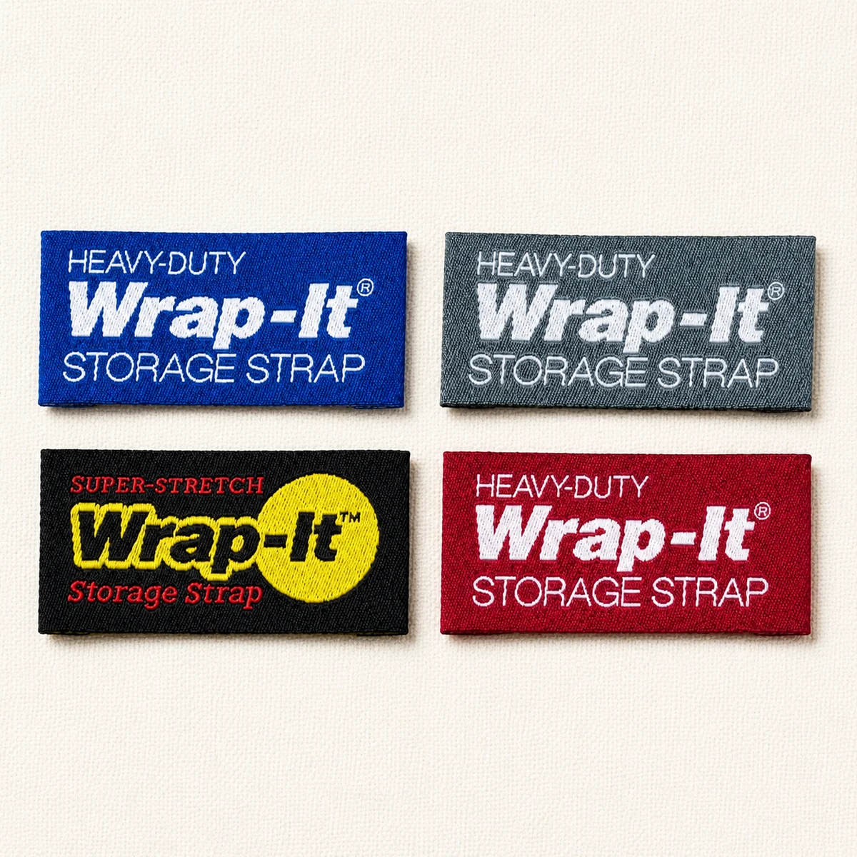 Custom woven Wrap-It heavy-duty storage strap labels in four colorways