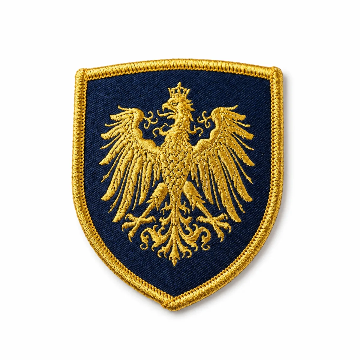 Woven heraldic gold eagle patch on a navy shield